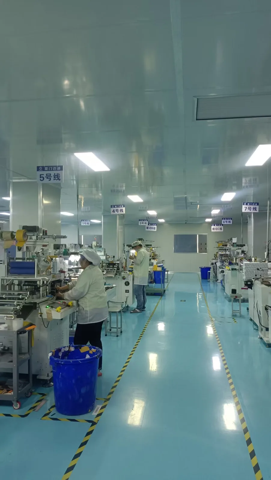 Clean production aisle with organized converting equipment